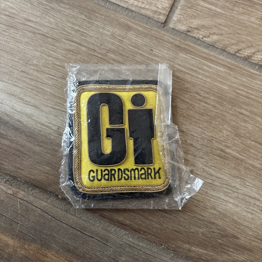 GI Guardsmark Patch Yellow Black Gold Trim Advertising 2.5 x 3.25 Inch NEW